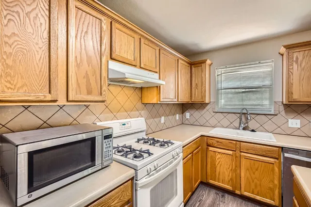 a kitchen with lots of counter top space and dining table