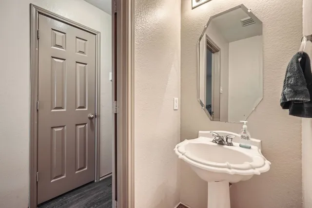 a kitchen with stainless steel appliances a stove a sink and a microwave