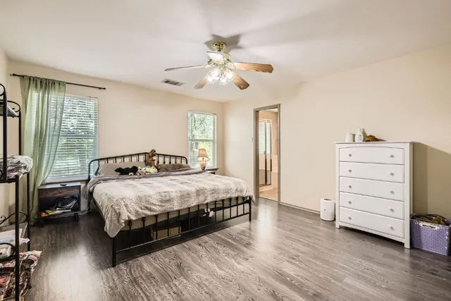 a bathroom with a sink a mirror and shower