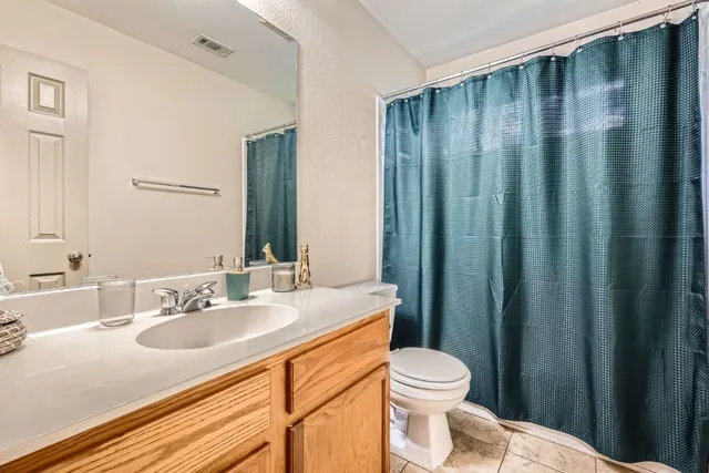 a bedroom with furniture and a wooden floor