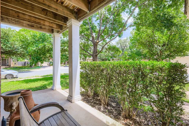 a view of a room with wooden floor and outdoor space