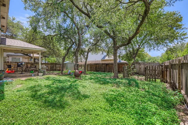a front view of a house with a yard table and chairs