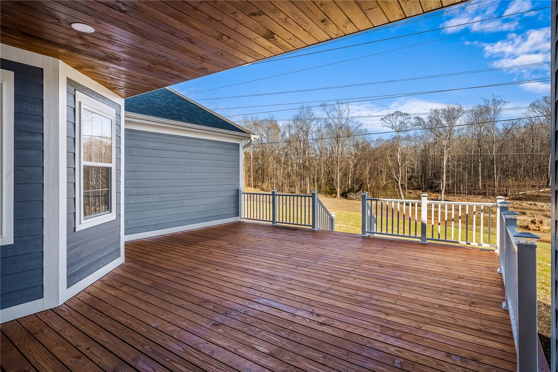 303 Regency Circle Anderson, SC 29625 - Photo 46 of 50 This spacious deck offers a tranquil retreat with expansive views of the natural landscape.