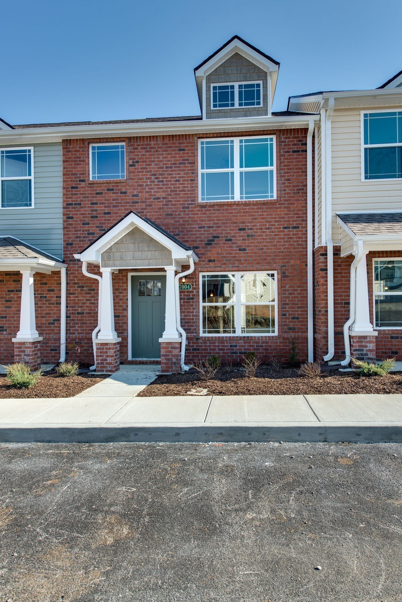 3010 Coriander Dr Spring Hill Spring Hill, TN 37174 - Photo 2 of 37 a front view of a house with a yard and garage