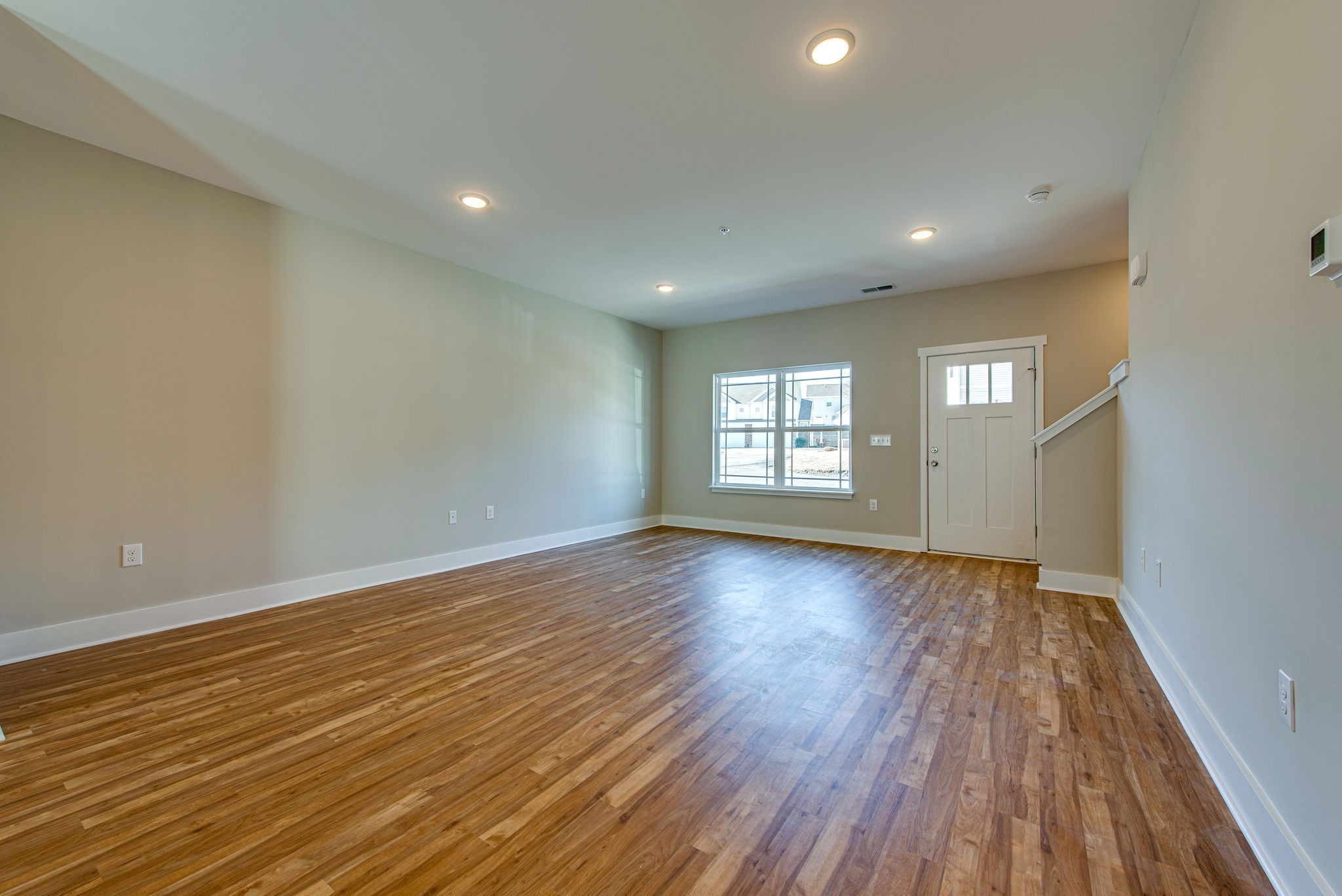 3010 Coriander Dr Spring Hill Spring Hill, TN 37174 - Photo 15 of 37 an empty room with wooden floor and windows