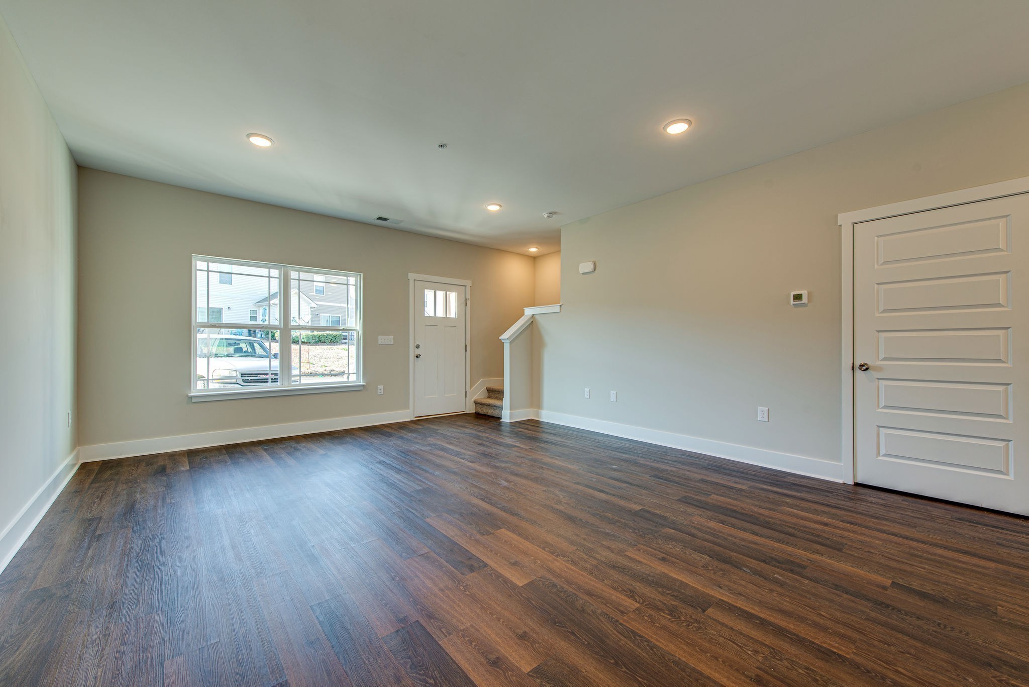 3010 Coriander Dr Spring Hill Spring Hill, TN 37174 - Photo 18 of 37 an empty room with wooden floor and windows