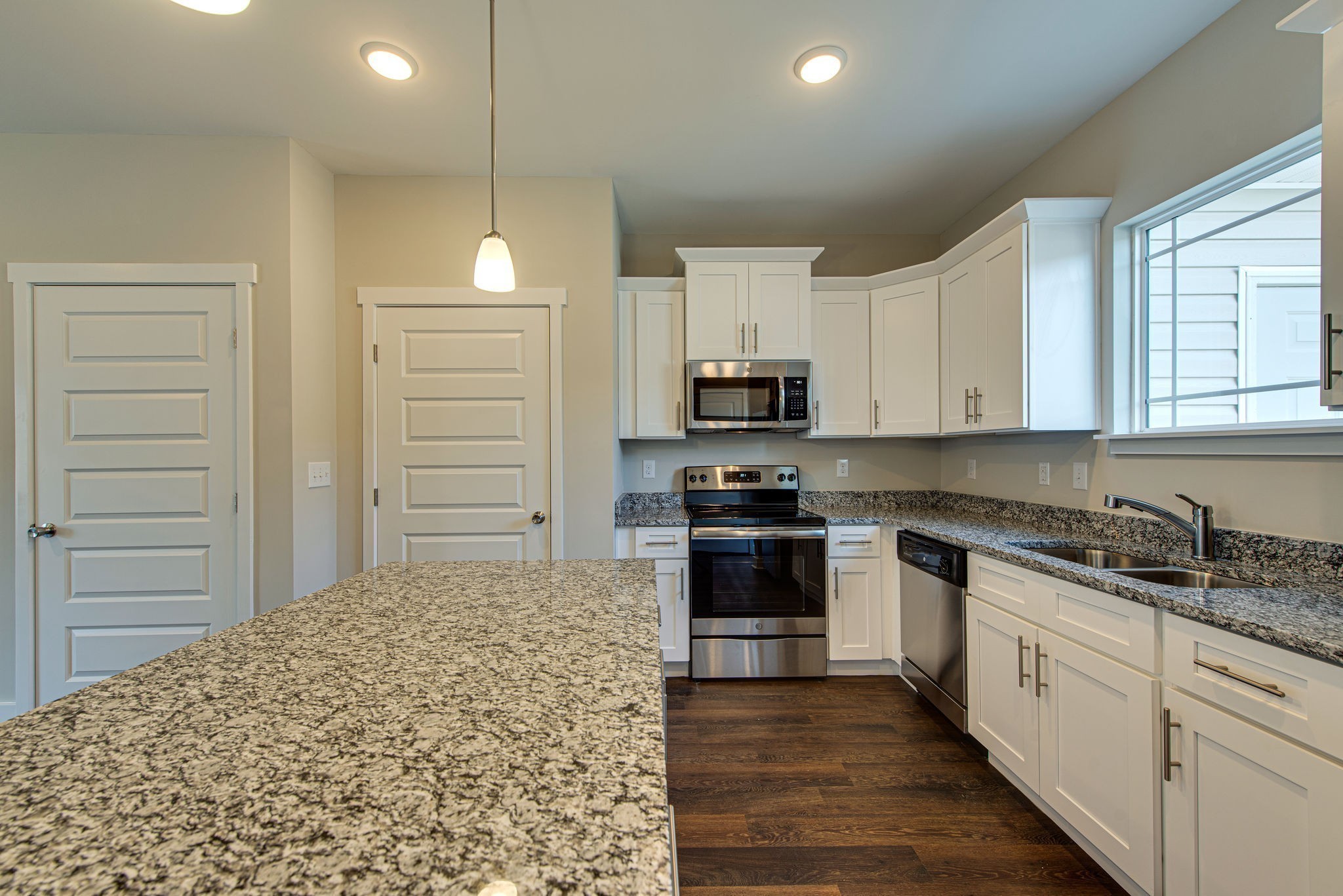 3010 Coriander Dr Spring Hill Spring Hill, TN 37174 - Photo 24 of 37 a kitchen with a sink stove and cabinets