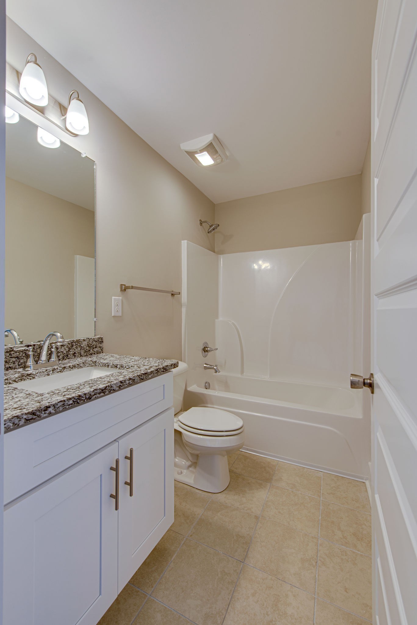 3010 Coriander Dr Spring Hill Spring Hill, TN 37174 - Photo 30 of 37 a bathroom with a granite countertop sink a toilet a mirror and bathtub