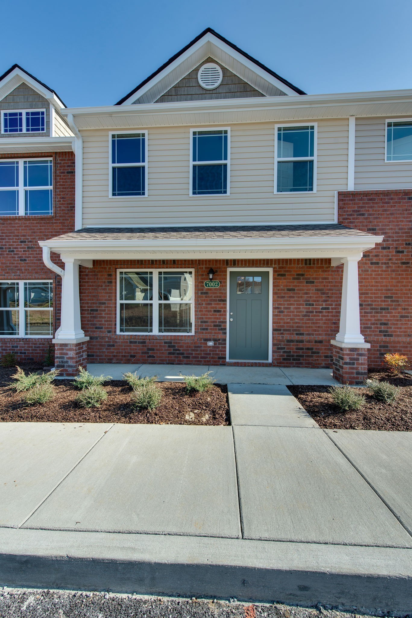3010 Coriander Dr Spring Hill Spring Hill, TN 37174 - Photo 5 of 37 a front view of a house with garden