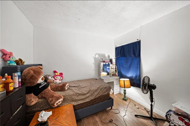 a bedroom with furniture and a bed