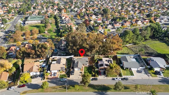 an aerial view of residential house and parking space