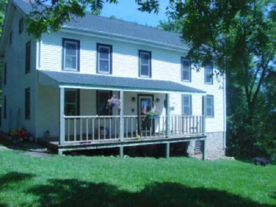 8888 East Walnut Grove Road Davis, IL 61019 - Photo 1 of 6 a view of front of house with a yard
