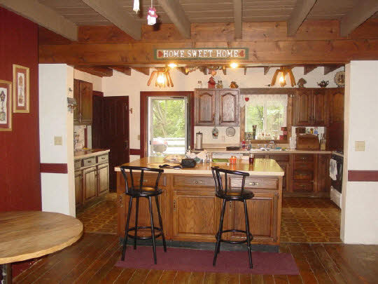 8888 East Walnut Grove Road Davis, IL 61019 - Photo 3 of 6 a view of a dining room with furniture window and wooden floor