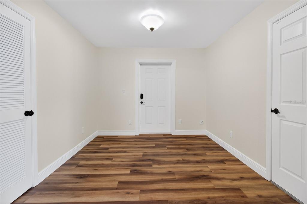 2174 19th Avenue Southwest Largo, FL 33774 - Photo 12 of 31 a view of a room with wooden floor
