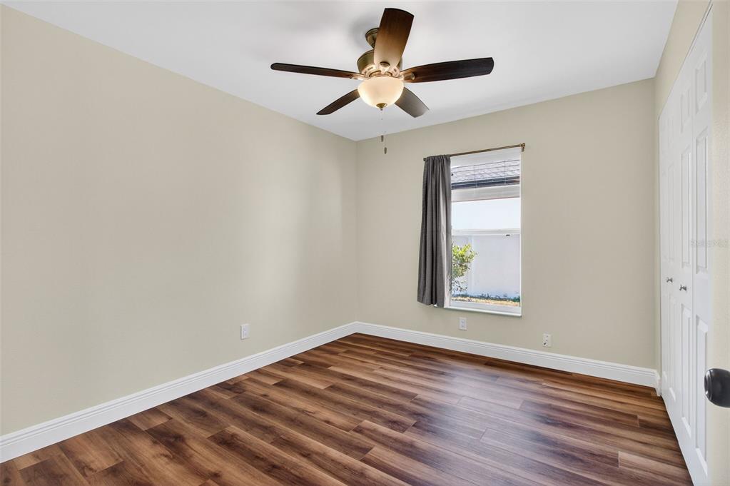 2174 19th Avenue Southwest Largo, FL 33774 - Photo 15 of 31 an empty room with wooden floor and windows
