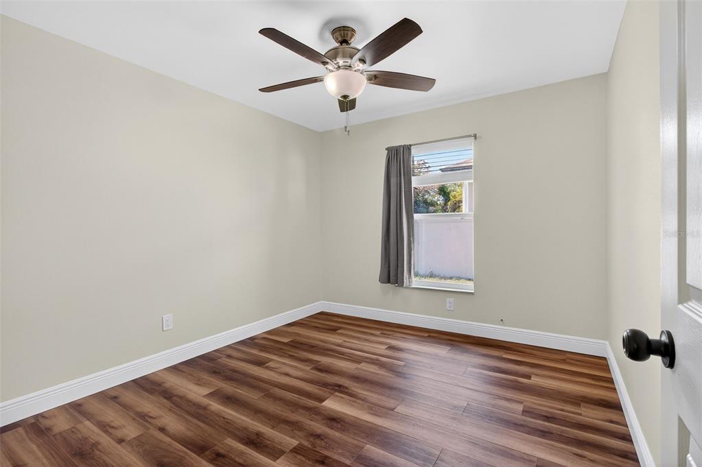 2174 19th Avenue Southwest Largo, FL 33774 - Photo 17 of 31 wooden floor in an empty room with a window