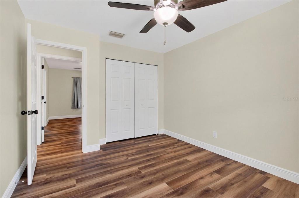 2174 19th Avenue Southwest Largo, FL 33774 - Photo 18 of 31 a view of an empty room and wooden floor