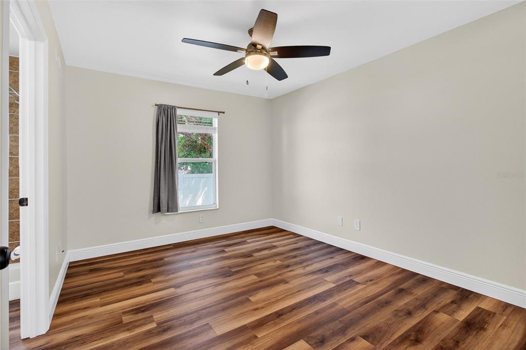 2174 19th Avenue Southwest Largo, FL 33774 - Photo 19 of 31 a view of room with window and ceiling fan