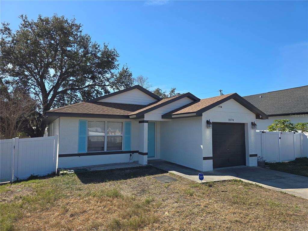 2174 19th Avenue Southwest Largo, FL 33774 - Photo 2 of 31 a house with trees in the background