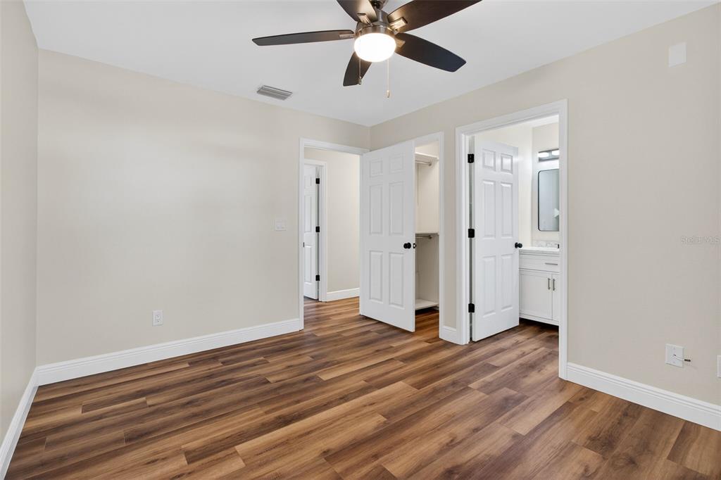 2174 19th Avenue Southwest Largo, FL 33774 - Photo 21 of 31 a view of an empty room and wooden floor