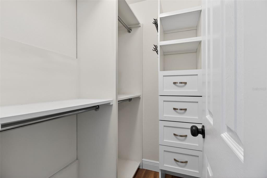 2174 19th Avenue Southwest Largo, FL 33774 - Photo 22 of 31 a view of walk in closet with empty racks