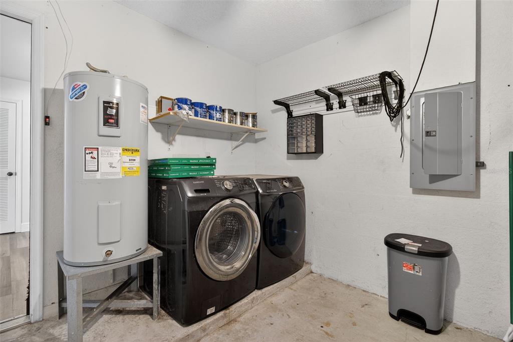 2174 19th Avenue Southwest Largo, FL 33774 - Photo 25 of 31 a utility room with dryer washer and a view of living room