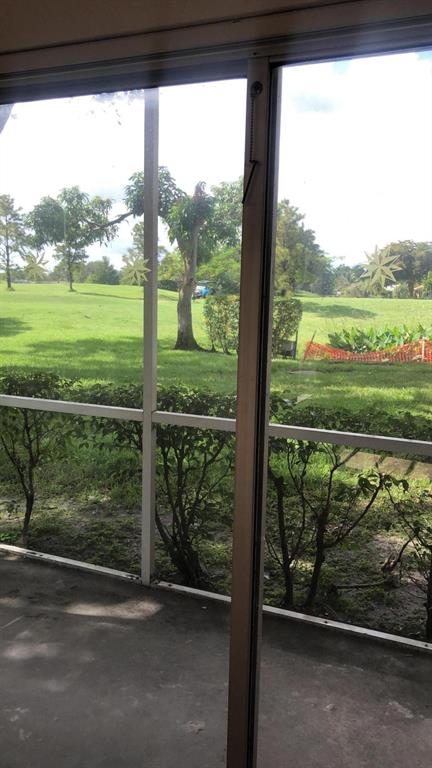 2481 Southwest 82nd Avenue, Unit 101 Davie, FL 33324 - Photo 14 of 14 a view of a yard with a street from a window