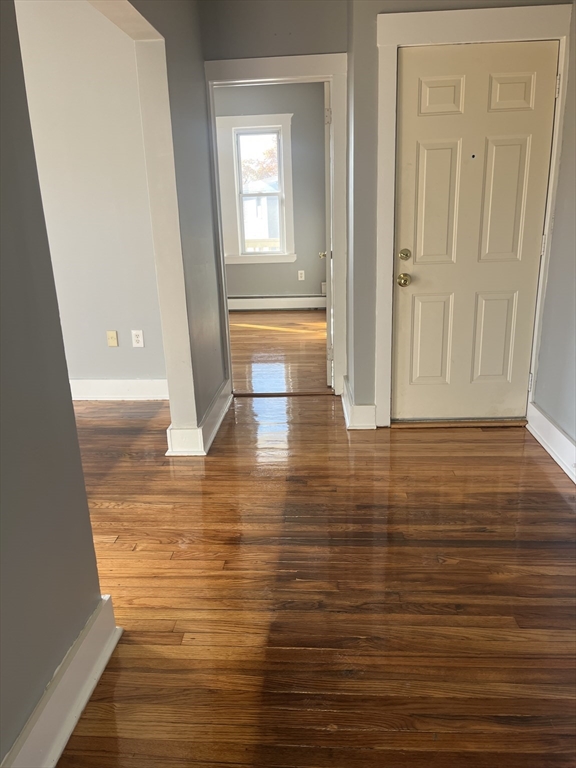 52 Mascot Street, Unit 6 Boston, MA 02124 - Photo 4 of 12 a view of empty room with wooden floor