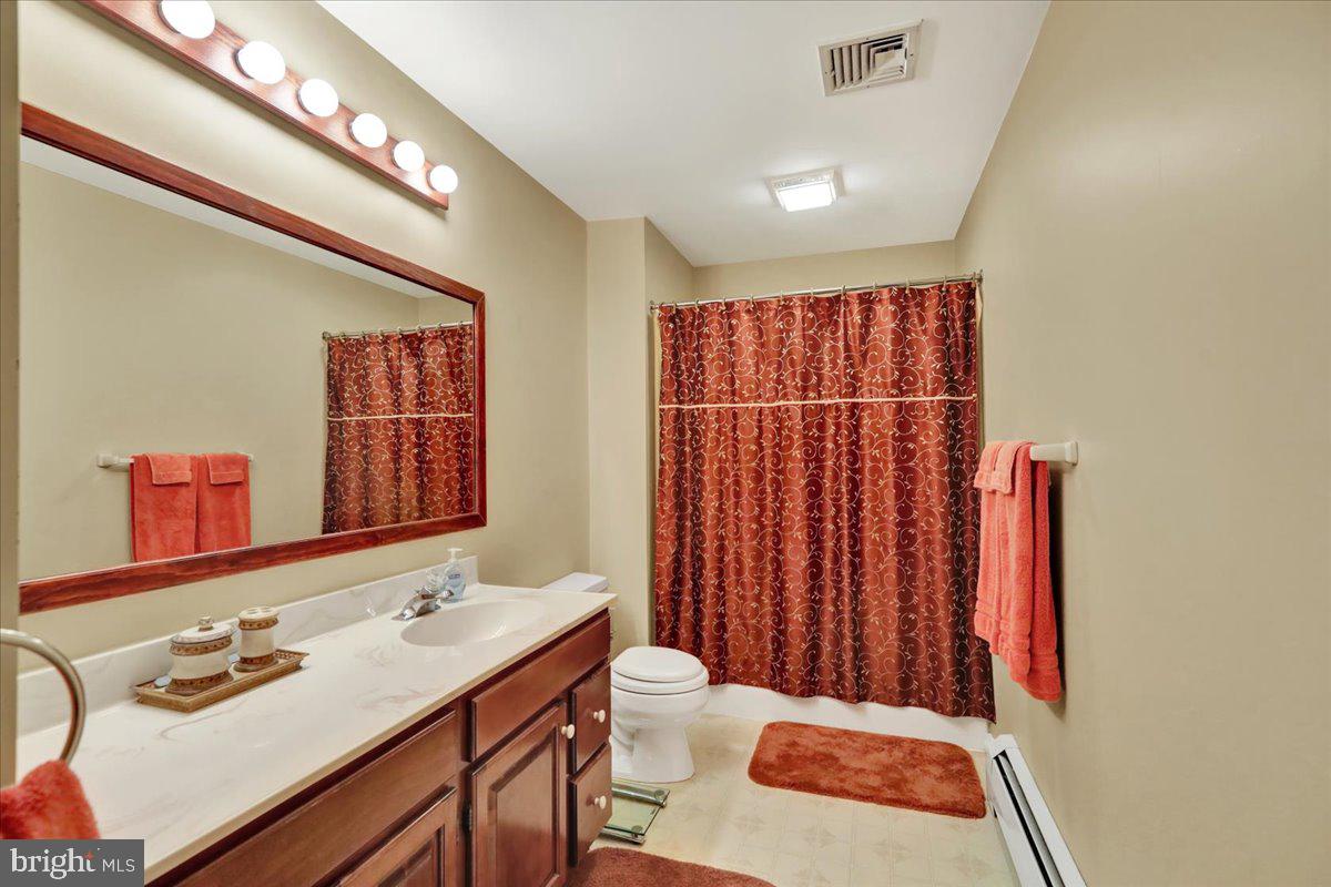 1649 Sherwood Road Reading, PA 19610 - Photo 14 of 37 a bathroom with a sink vanity granite and a mirror