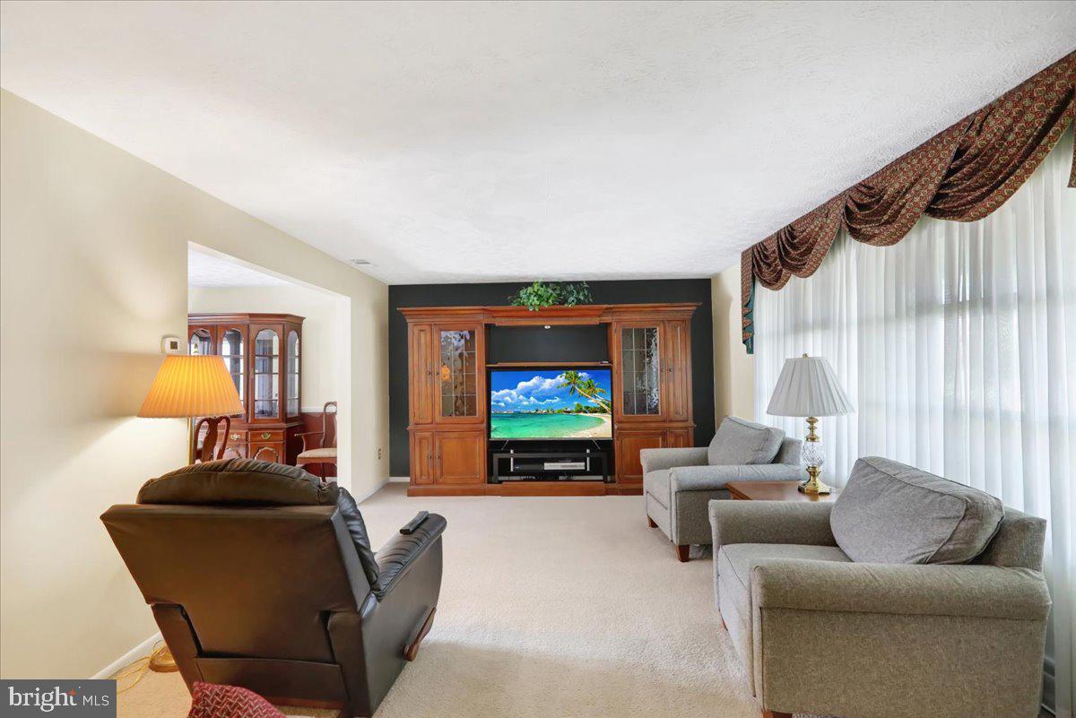 1649 Sherwood Road Reading, PA 19610 - Photo 3 of 37 a living room with furniture and a flat screen tv