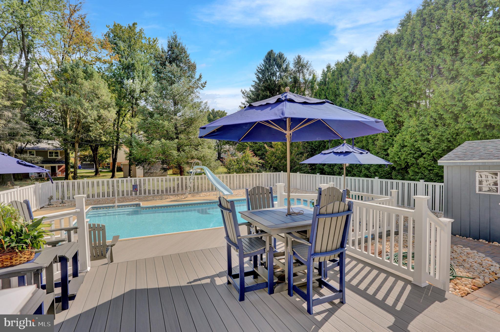 1649 Sherwood Road Reading, PA 19610 - Photo 32 of 37 a patio with wooden floor a yard a table and chairs