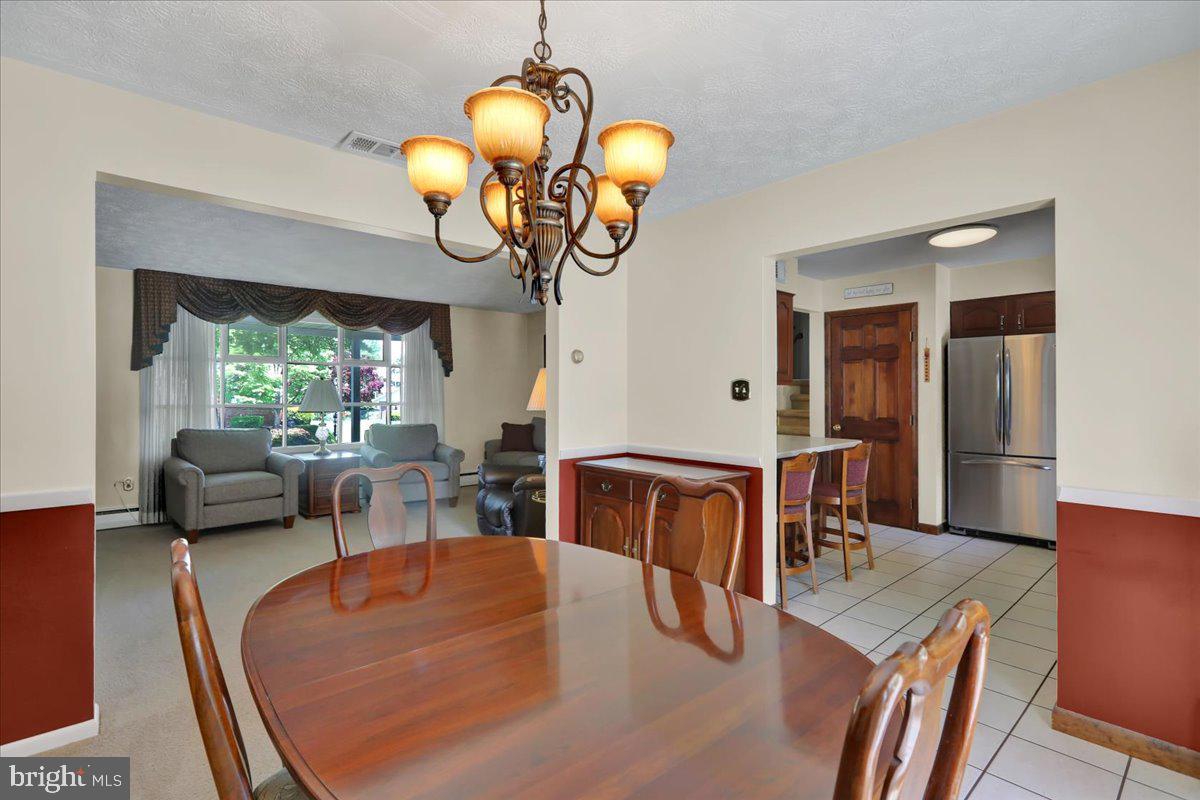 1649 Sherwood Road Reading, PA 19610 - Photo 6 of 37 a view of a dining room with furniture window and wooden floor