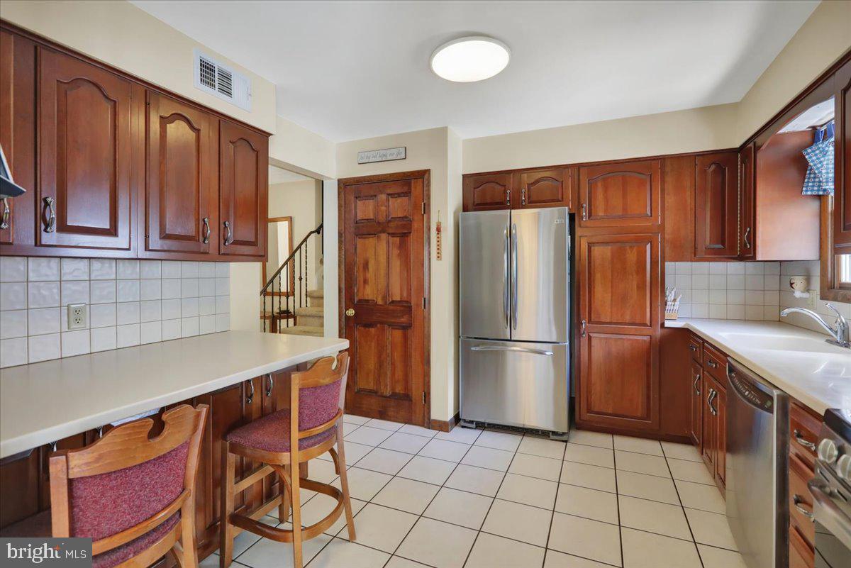1649 Sherwood Road Reading, PA 19610 - Photo 8 of 37 a kitchen with stainless steel appliances a refrigerator and a sink