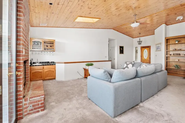a view of kitchen with stainless steel appliances granite countertop a stove and a microwave