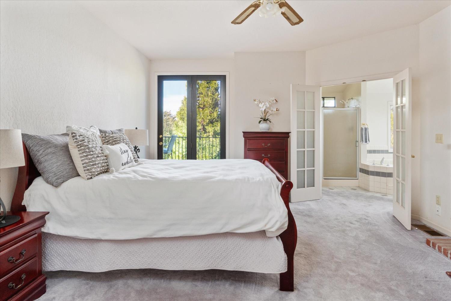 257 Snowberry Court Murphys, CA 95247 - Photo 22 of 56 a bed sitting in a spacious bedroom next to a window