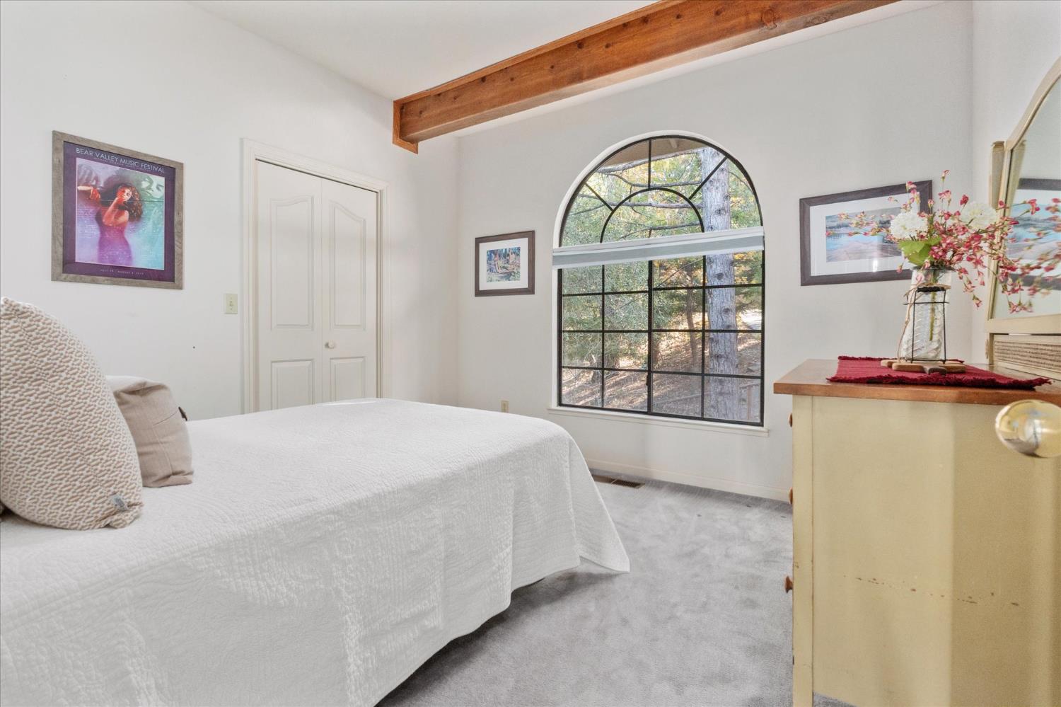 257 Snowberry Court Murphys, CA 95247 - Photo 28 of 56 a bedroom with a bed and a window