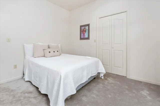 a bathroom with a double vanity sink toilet and shower