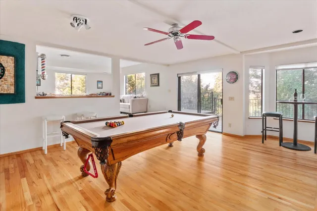 a kitchen with stainless steel appliances kitchen island granite countertop a table and chairs