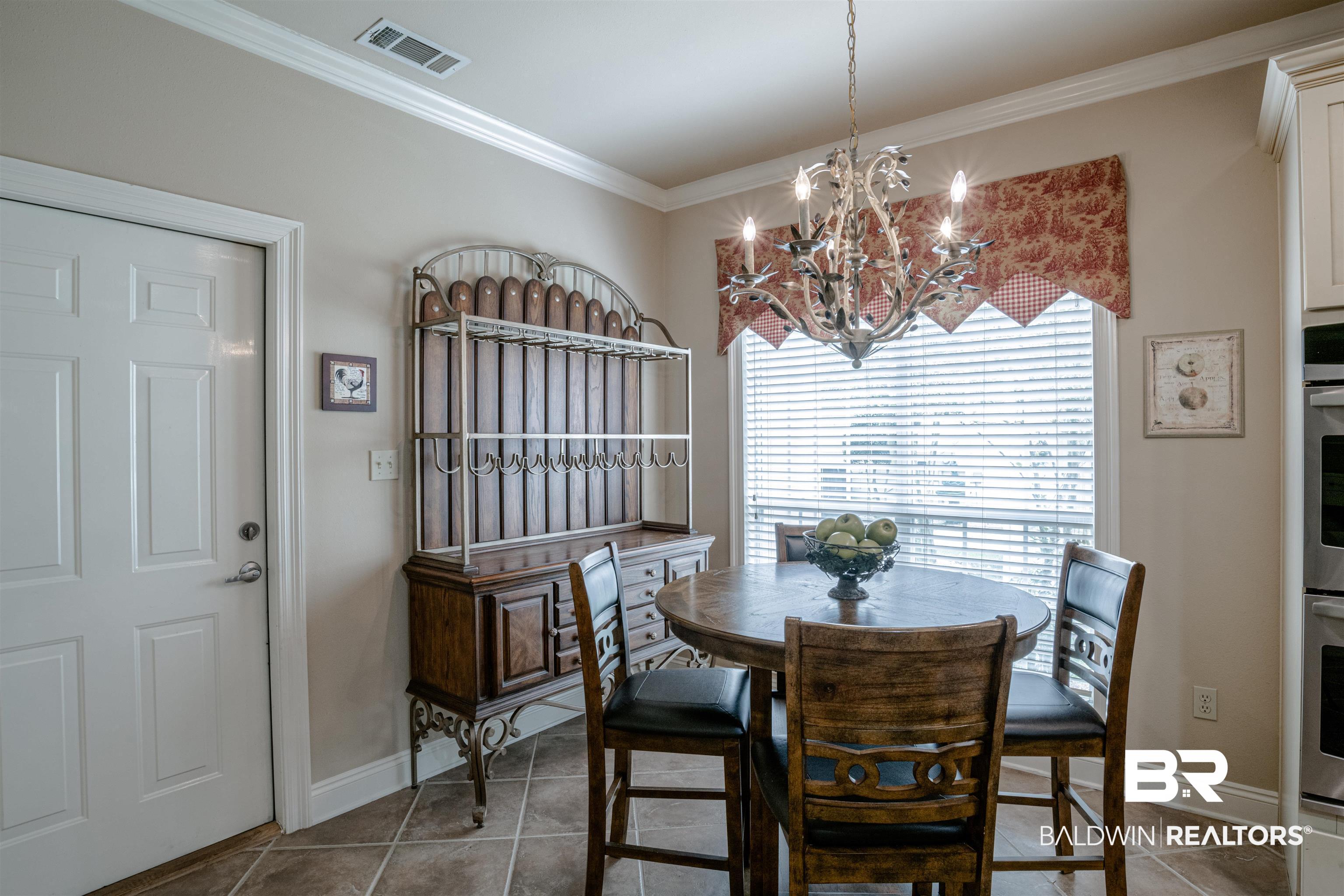 211 Savannah Circle Foley, AL 36535 - Photo 35 of 46 Breakfast Area and Garage Entry