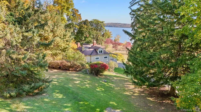 a aerial view of a house with a yard