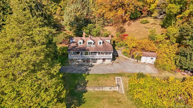 an aerial view of a house with swimming pool
