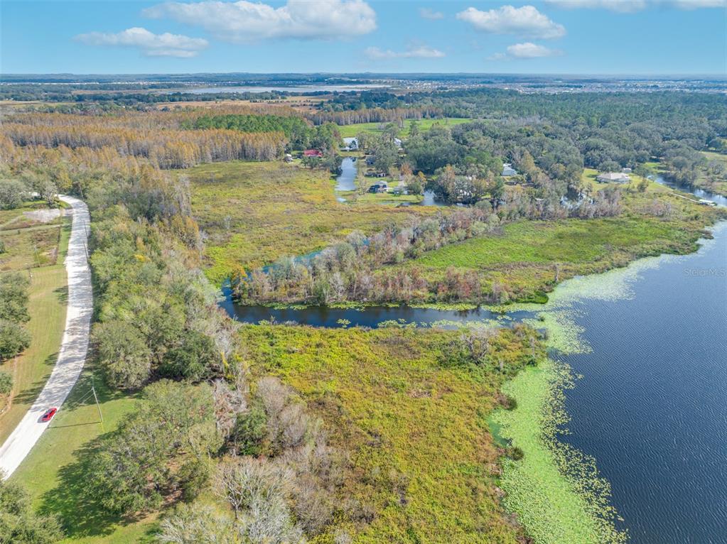 0 McKendree Road Wesley Chapel, FL 33545 - Photo 8 of 25 a view of a lake with a big yard