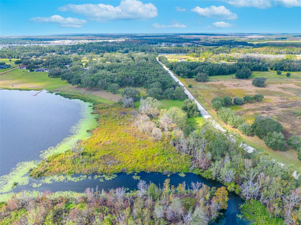 0 McKendree Road Wesley Chapel, FL 33545 - Photo 10 of 25 a view of a lake with a yard