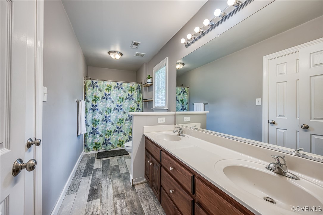 2118 Dorrell Road Aylett, VA 23009 - Photo 23 of 36 Full bath with wood finished floors, double vanity