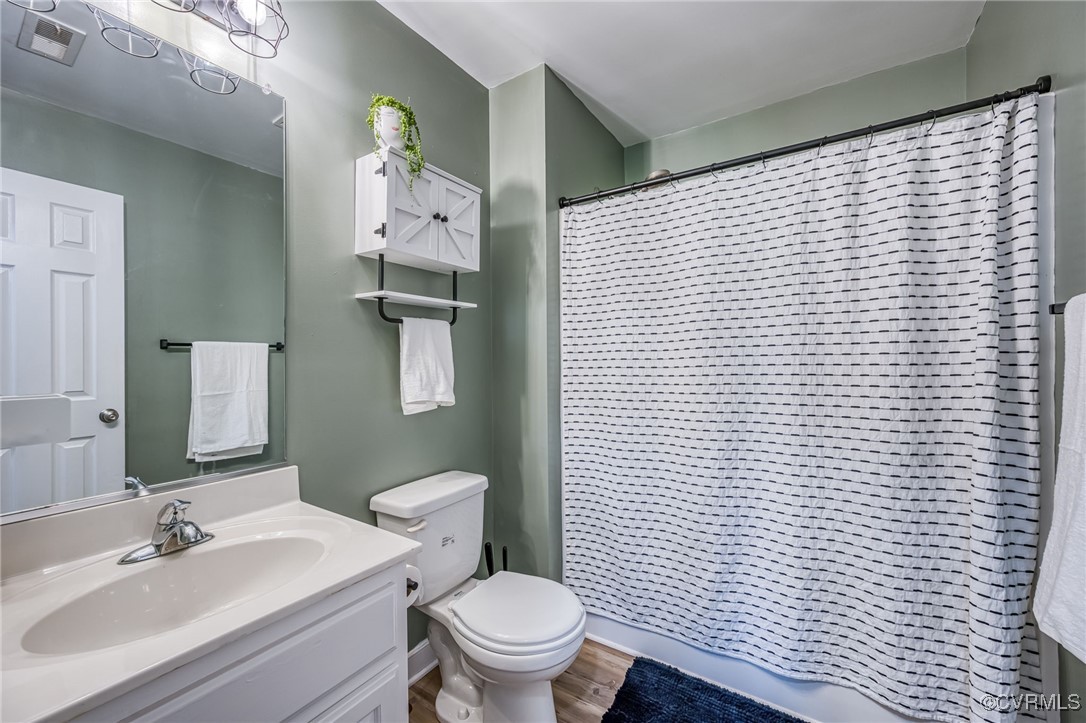 2118 Dorrell Road Aylett, VA 23009 - Photo 26 of 36 Full bath with vanity, wood finished floors, and c