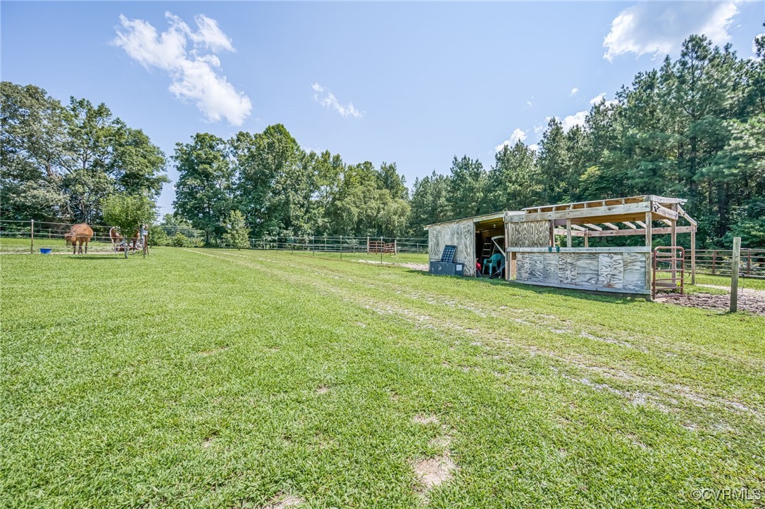 2118 Dorrell Road Aylett, VA 23009 - Photo 28 of 36 View of grassy yard featuring an outbuilding, an e