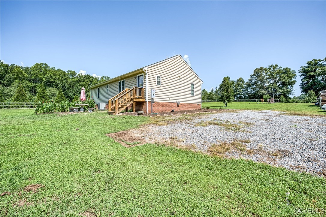 2118 Dorrell Road Aylett, VA 23009 - Photo 32 of 36 Rear view of property with a yard and crawl space