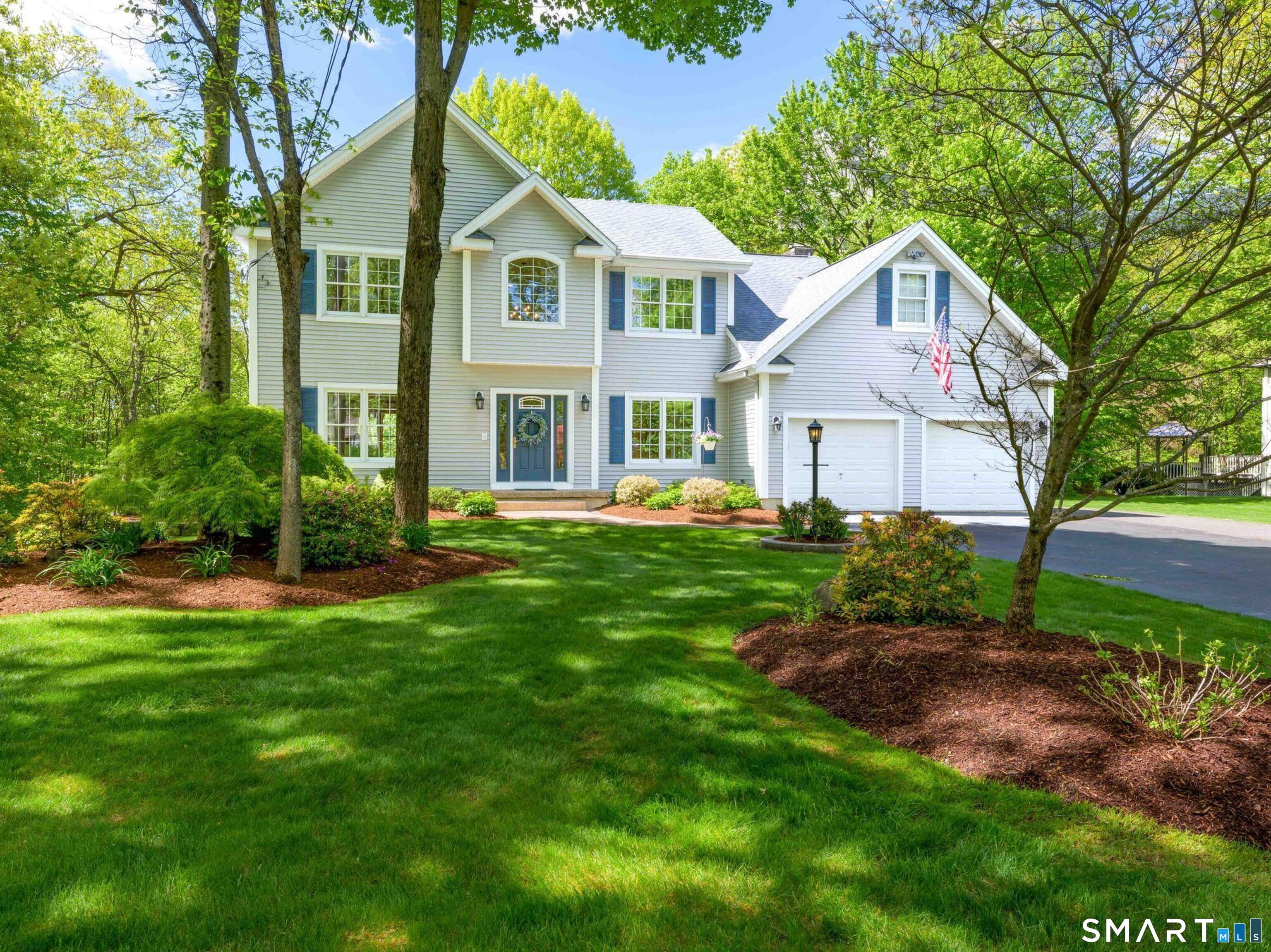 4 Crystal Lane Wallingford, CT 06492 - Photo 1 of 40 a front view of a house with a yard and trees