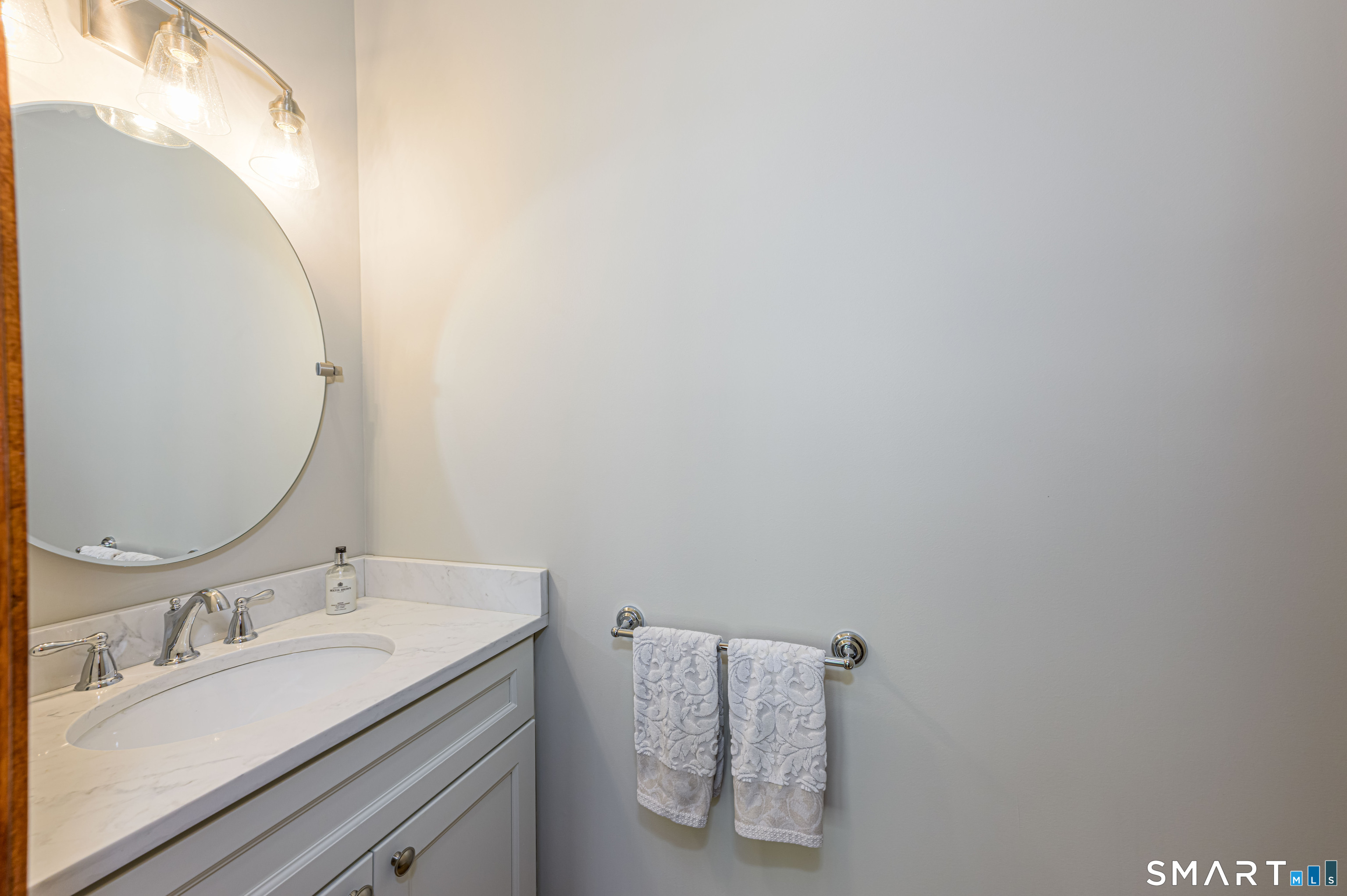4 Crystal Lane Wallingford, CT 06492 - Photo 14 of 40 a bathroom with a granite countertop sink and a mirror