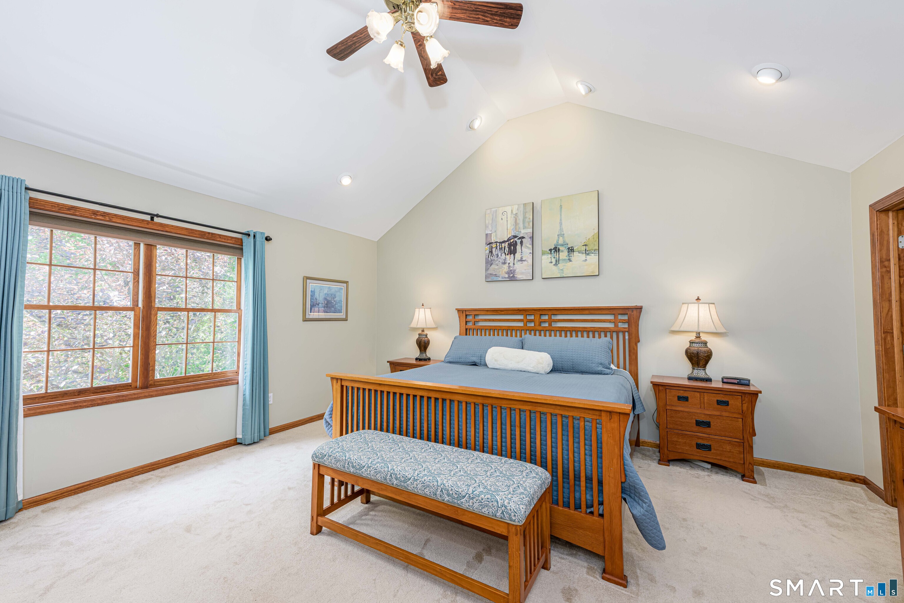 4 Crystal Lane Wallingford, CT 06492 - Photo 15 of 40 a bedroom with a bed and a chandelier